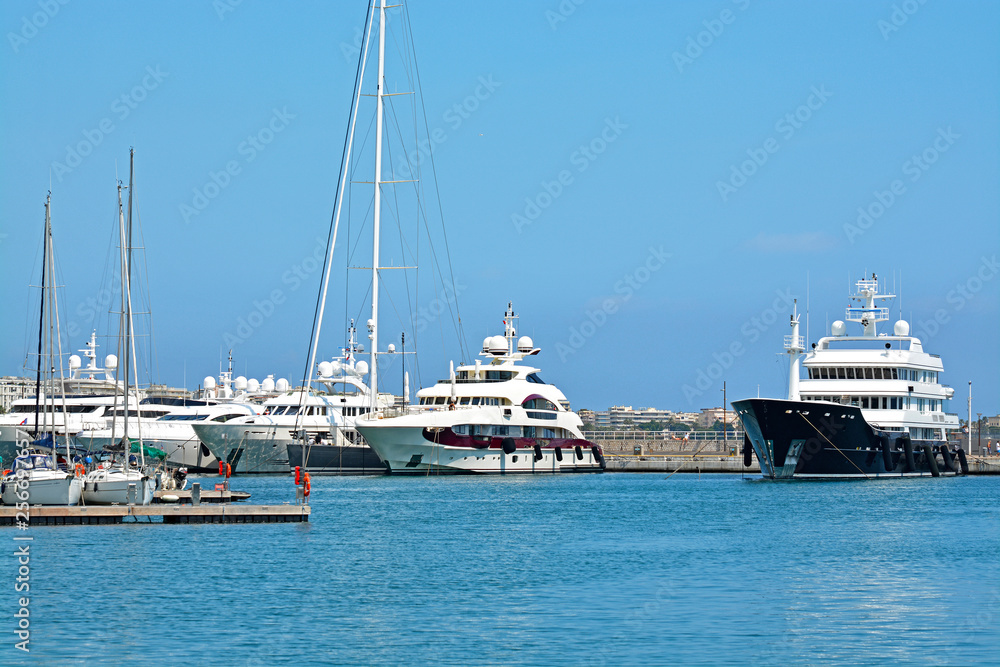 Yachts anchored in Port Pierre Canto at the Boulevard de la Croisette in Cannes, France.