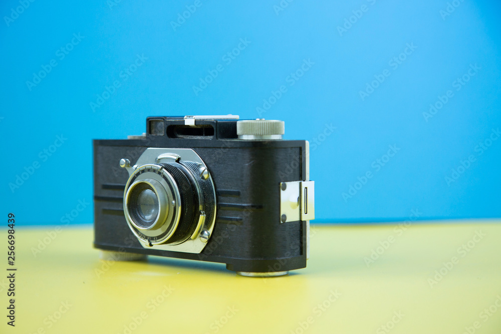 A retro vintage camera shot on a colorful background