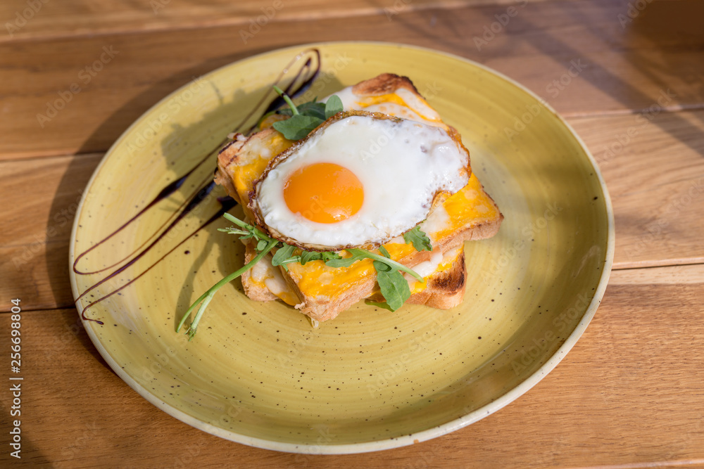 Delicious egg toast breakfast served on a plate Delicious egg toast breakfast served on a plate