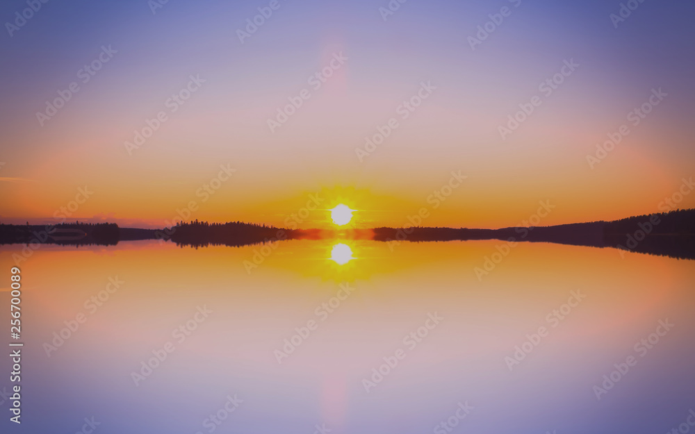 Sunset lake view with perfect reflection. Photo from Sotkamo, Finland.