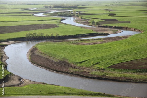 Meandering stream with mountains and clouds at The Persembe Plateau at Ordu, Turkey 