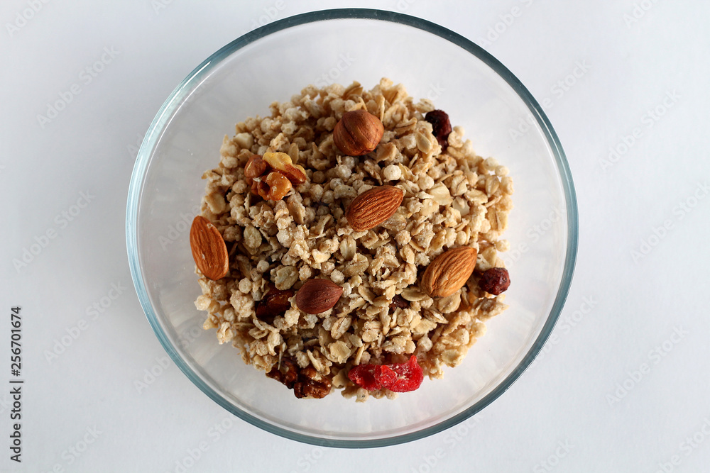 Bowl of cereal with fresh fruits and nuts. Bowl of cereal with fresh fruits and nuts.
