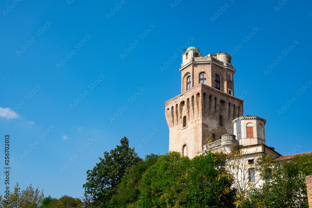 tower of Astronomical Observatory of Padua, Italy. Against blue sky, space for text