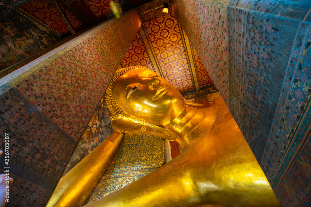 Reclining golden buddha inside of pagoda Wat Pho