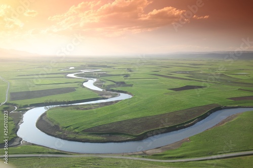 Meandering stream with mountains and clouds at The Persembe Plateau at Ordu, Turkey 