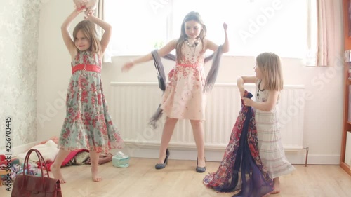 Pre teen caucasian girl dancing and playing dress up themes of siblings pretend dress up carefree
