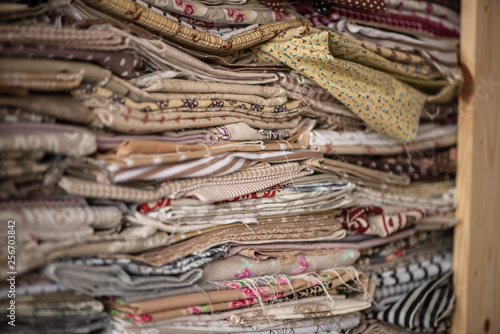 Wallpaper Mural piles of  textile cotton material for sewing dress making stiching hobby craft  Torontodigital.ca