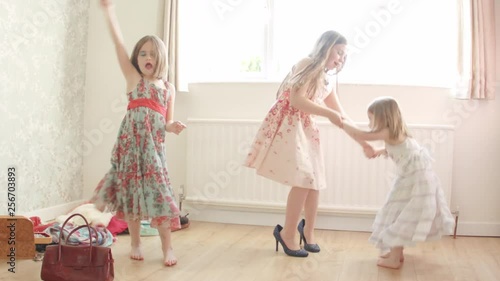 Pre teen caucasian girl dancing and playing dress up themes of siblings pretend dress up carefree