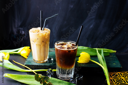 Bild auf Leinwand Two transparent glasses of cold coffee drinks with iced cubes