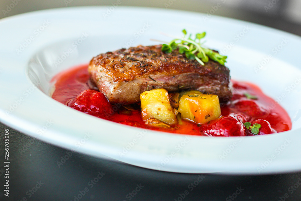 duck breast, vegetables, berry sauce and microgreen (main dish). food background. top view duck breast, vegetables, berry sauce and microgreen (main dish). food background. top view