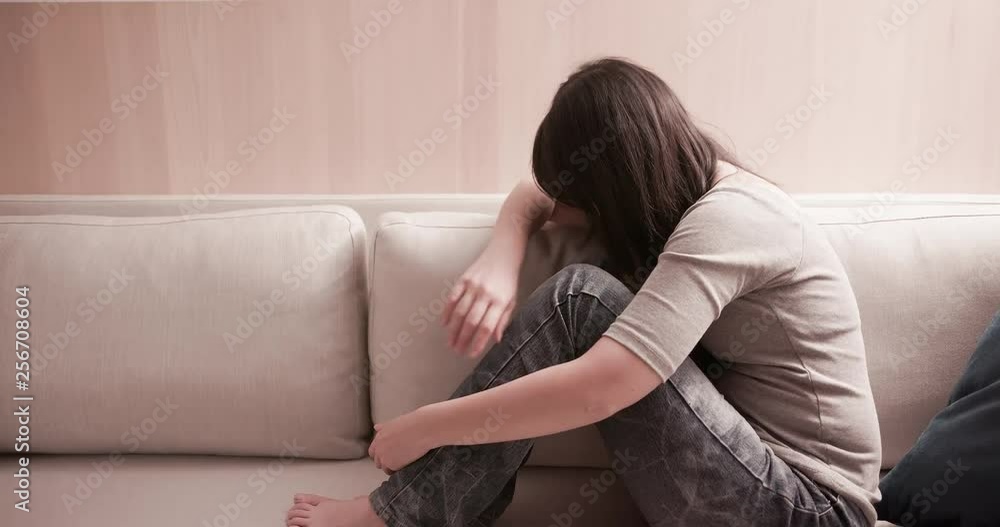 woman feel depressed on sofa woman feel depressed on sofa