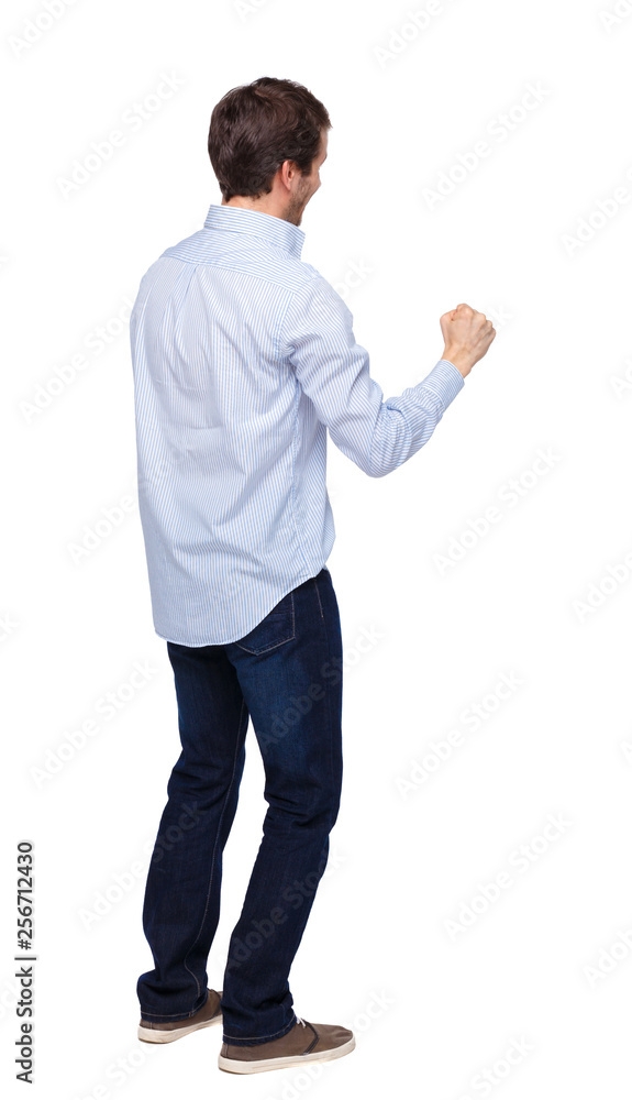 Back view of a man celebrating victory. Back view of a man celebrating victory.