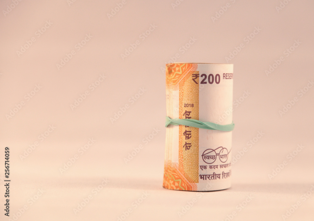 roll of 200 Rupee notes