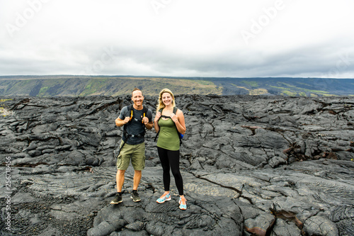 The couple Tourist visiting the lava field at hawaii