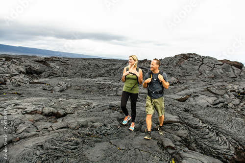 The couple Tourist visiting the lava field at hawaii