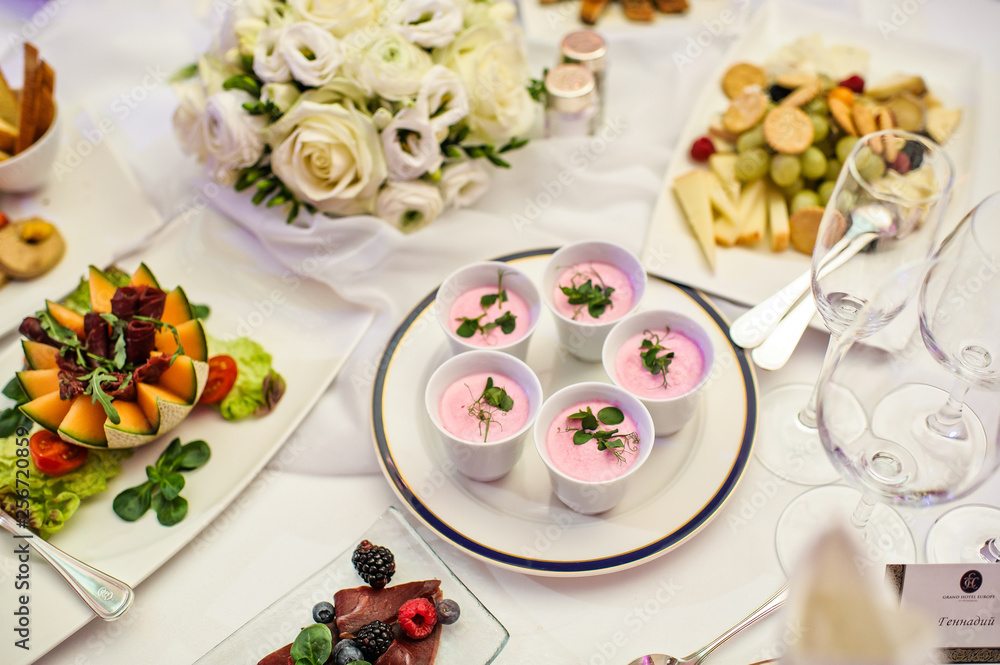 Pink Panna cotta in cups. Banquet table in the restaurant