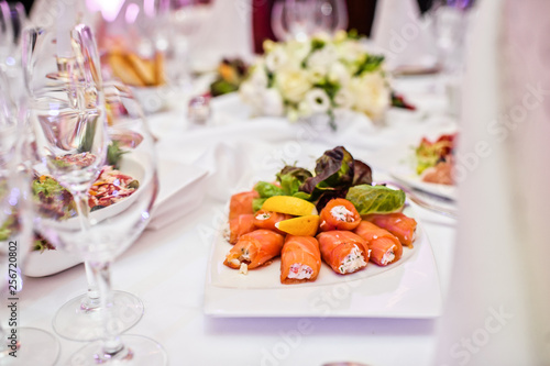 smoked salmon roll with cheese. Banquet in a luxurious restaurant