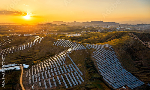 Aerial photo of solar photovoltaic panel scene in the sunset