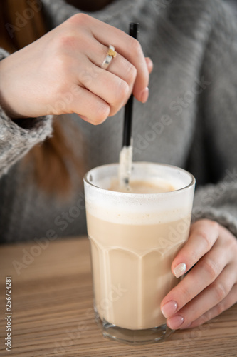 Wallpaper Mural Young women are drinking latte coffee placed on a table at cafe in holiday. Torontodigital.ca
