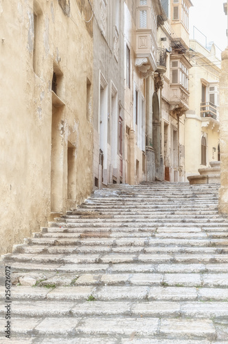 Vintage street in the city Valletta on Malta. High key image.