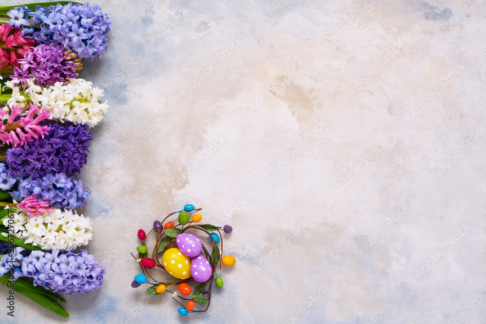 Easter decoration and hyacinth flowers bouquet flatlay. Copy space, top view. Easter celebration concept.