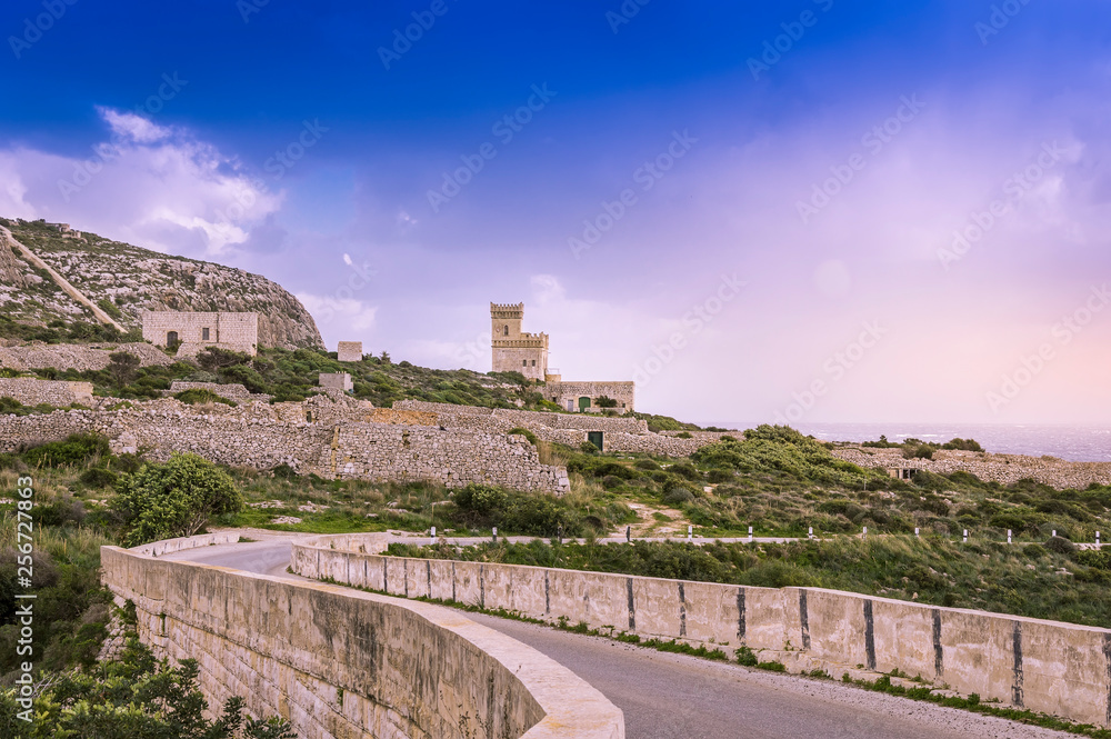 Malta: Scenic road to Ghar Lapsi tower with hilly landscape and sea