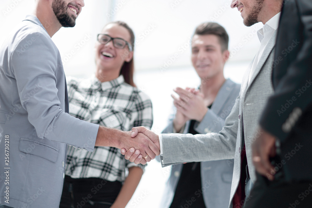 An attractive, diverse business team meeting as a grou An attractive, diverse business team meeting as a grou