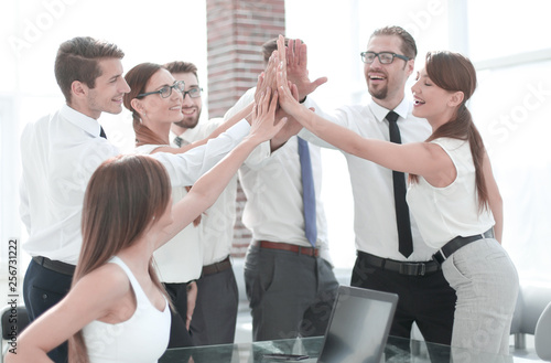 young business team giving each other high five