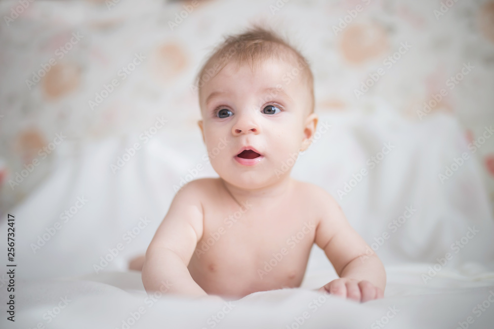 Baby boy relaxing in bed Baby boy relaxing in bed
