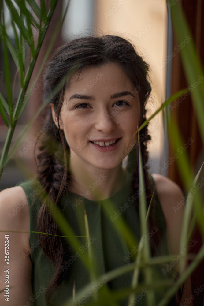 Portrait of young beautiful cute cheerful girl looking and posing for camera over background Portrait of young beautiful cute cheerful girl looking and posing for camera over background