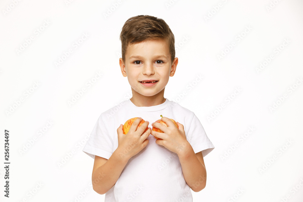 Little boy is holding apples studio shot Little boy is holding apples studio shot
