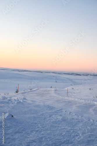 pink dawn in the tundra everywhere white snow nobody  road © yalo173