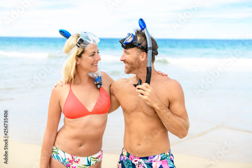 Couple on the beach is going to swim and snorkle on hawaii beach