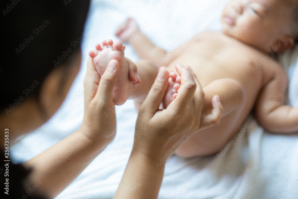 Baby foot massage by mom hand after shower Baby foot massage by mom hand after shower