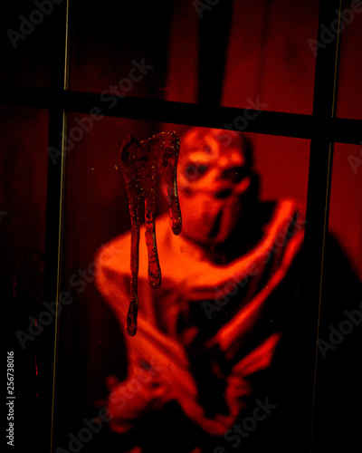 Wallpaper Mural masked person in straight jacked behind window Torontodigital.ca