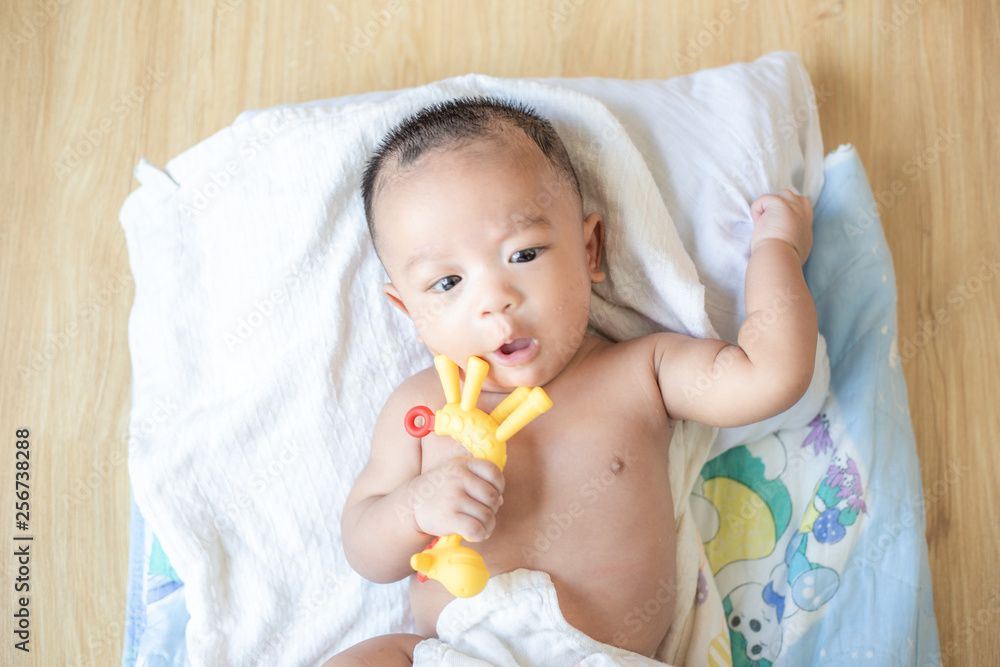 Smiling adorable infant 3 month baby lying on blanket Smiling adorable infant 3 month baby lying on blanket