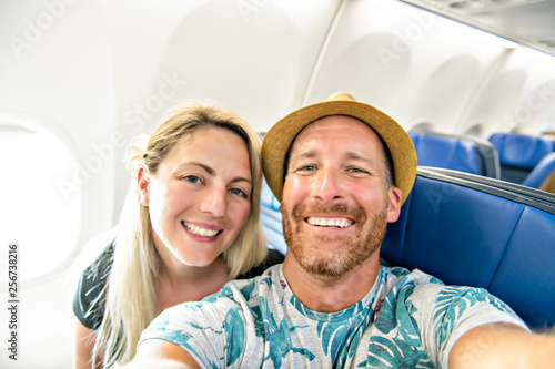 The Mid adult couple in economy class airliner