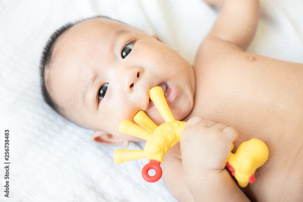 Smiling adorable infant 3 month baby lying on blanket Smiling adorable infant 3 month baby lying on blanket