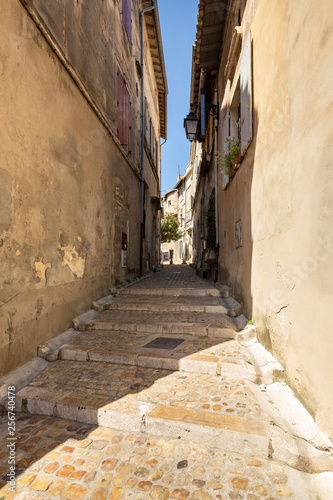 Beautiful typical French architecture in a narrow street in Arles, France © Michael Evans