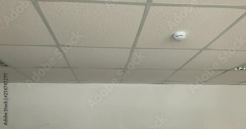 Armstrong ceiling in white room camera fly