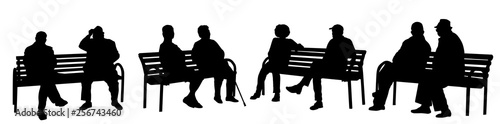 People silhouettes sitting on a bench