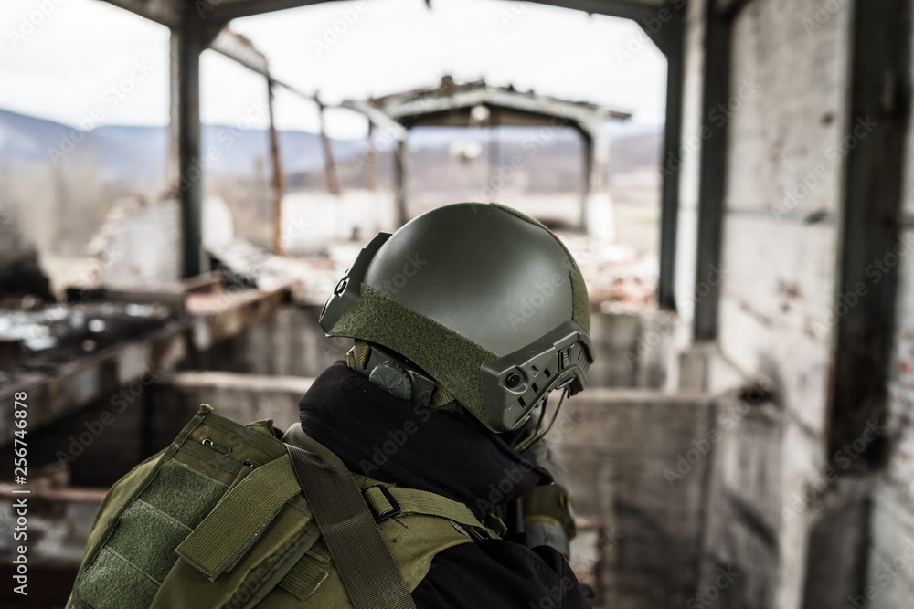 Special forces army soldier police swat armed with assault rifle on the watch waiting for the enemy Special forces army soldier police swat armed with assault rifle on the watch waiting for the enemy