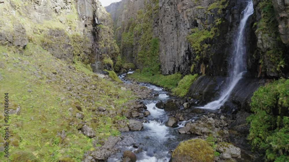 Aerial drone shot inside of canyon leading to Glymur waterfall in Iceland Aerial drone shot inside of canyon leading to Glymur waterfall in Iceland