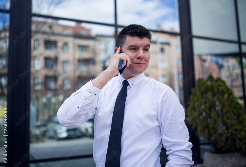 Smart businessman well dressed talking on the phone Smart businessman well dressed talking on the phone