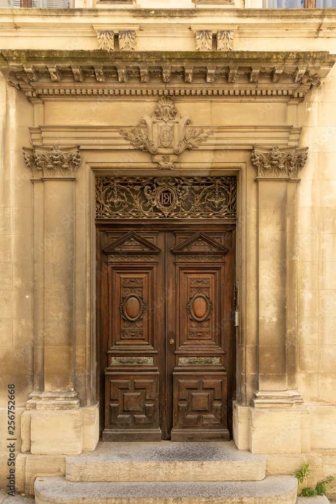 Ornamental wooden doors in Arles, France