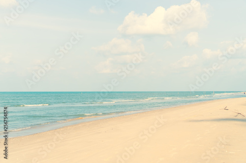 Tropical nature clean beach and white sand in summer with sun light blue sky and bokeh background. © ant