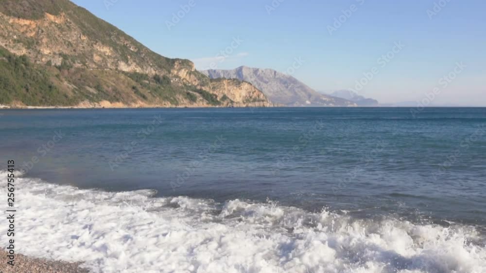 Big breaking sea wave on a beach in sunny day slow motion Big breaking sea wave on a beach in sunny day slow motion