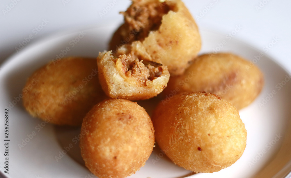 Combro, Indonesian traditional food. Made from cassava is grated and contain oncom sauce. ( Combro, Indonesian traditional food. Made from cassava is grated and contain oncom sauce. (
