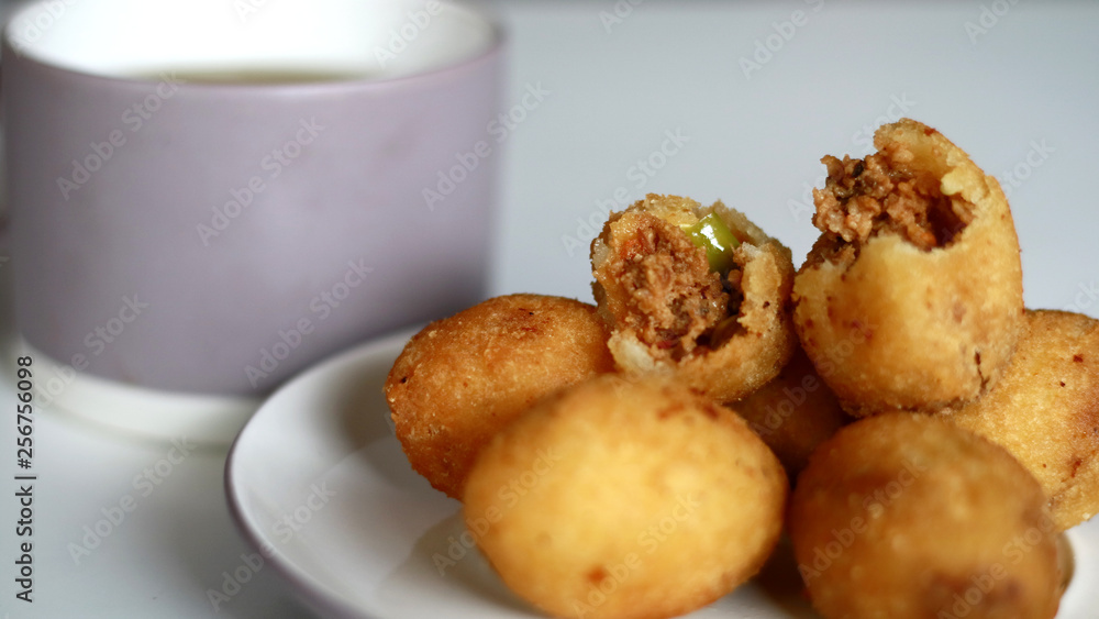 Combro, Indonesian traditional food, and a cup of tea. Combro, Indonesian traditional food, and a cup of tea.