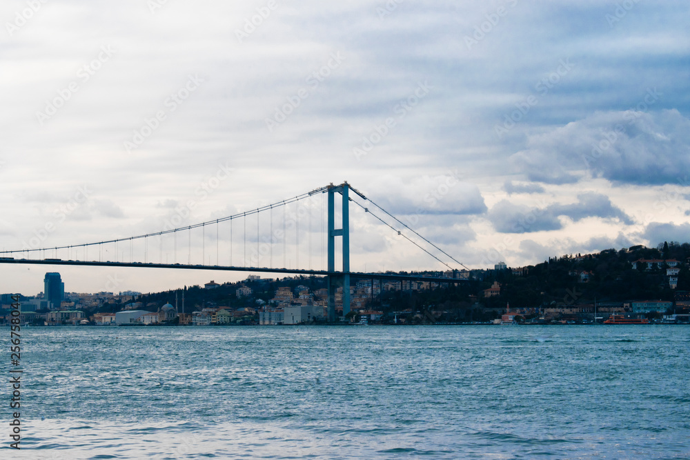 Fishing boats, yacht, seagulls, Bosphorus bridge and Marmara sea. Sunset in the Bosphorus and Fatih Sultan Mehmet bridge and throat view